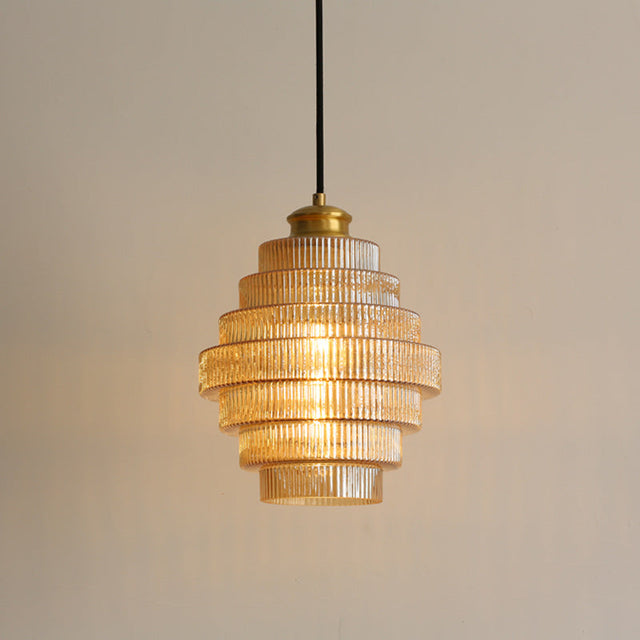 Brass and glass pendant light with sleek modern silhouette