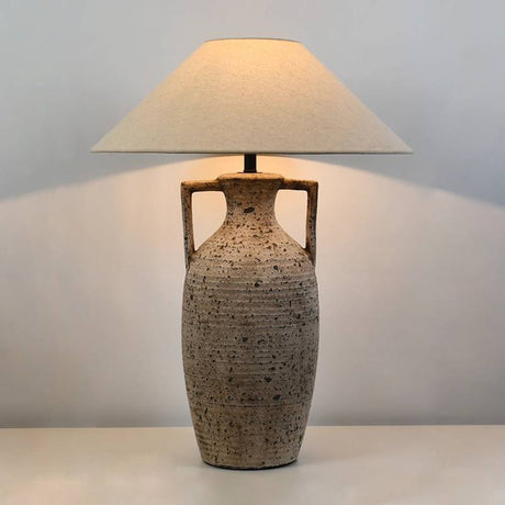 Textured ceramic table lamp with warm ambient lighting