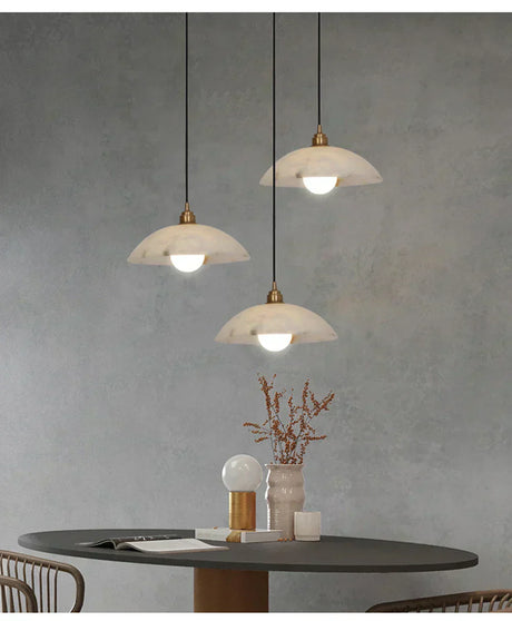 Close-up of iron and marble pendant fixture