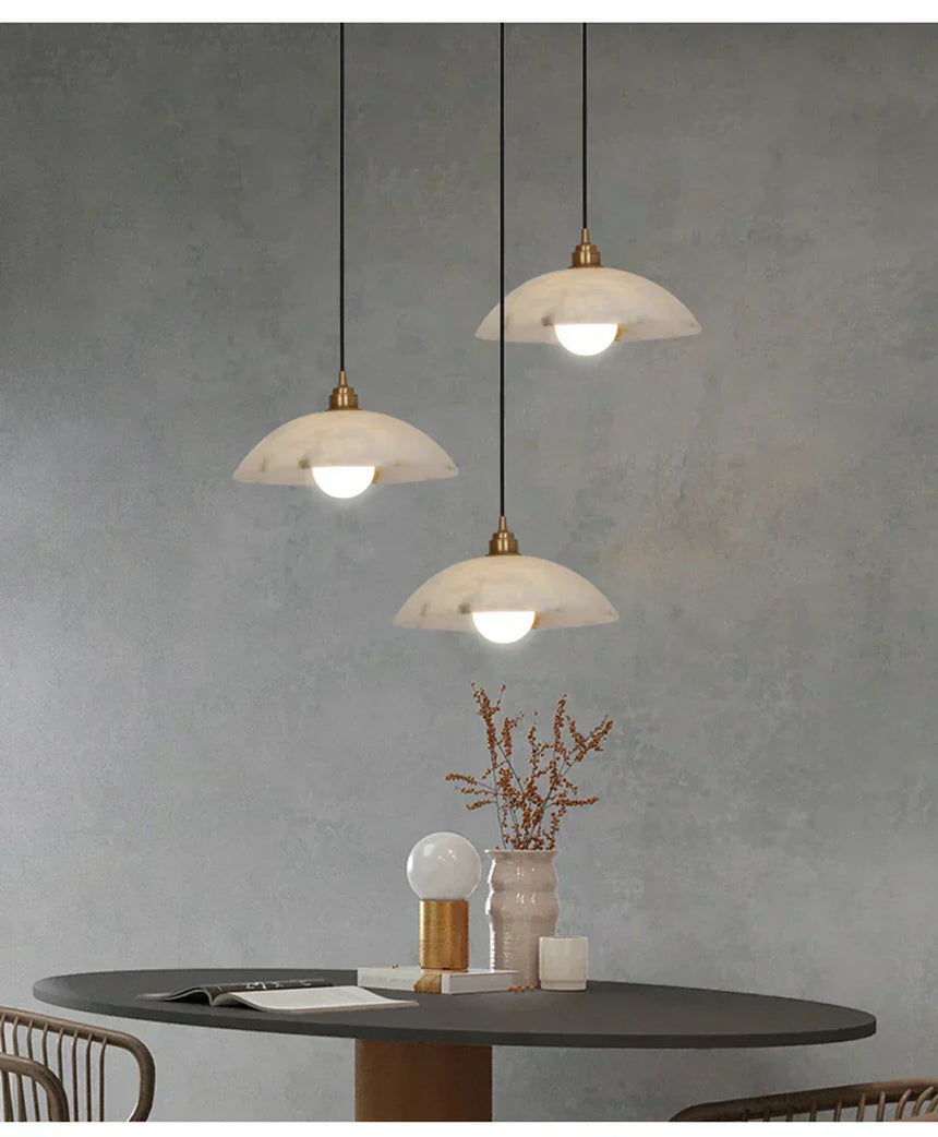 Close-up of iron and marble pendant fixture