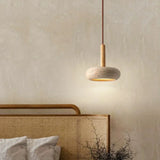 Compact travertine pendant for dining room