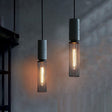 Iron pendant light suspended above kitchen counter