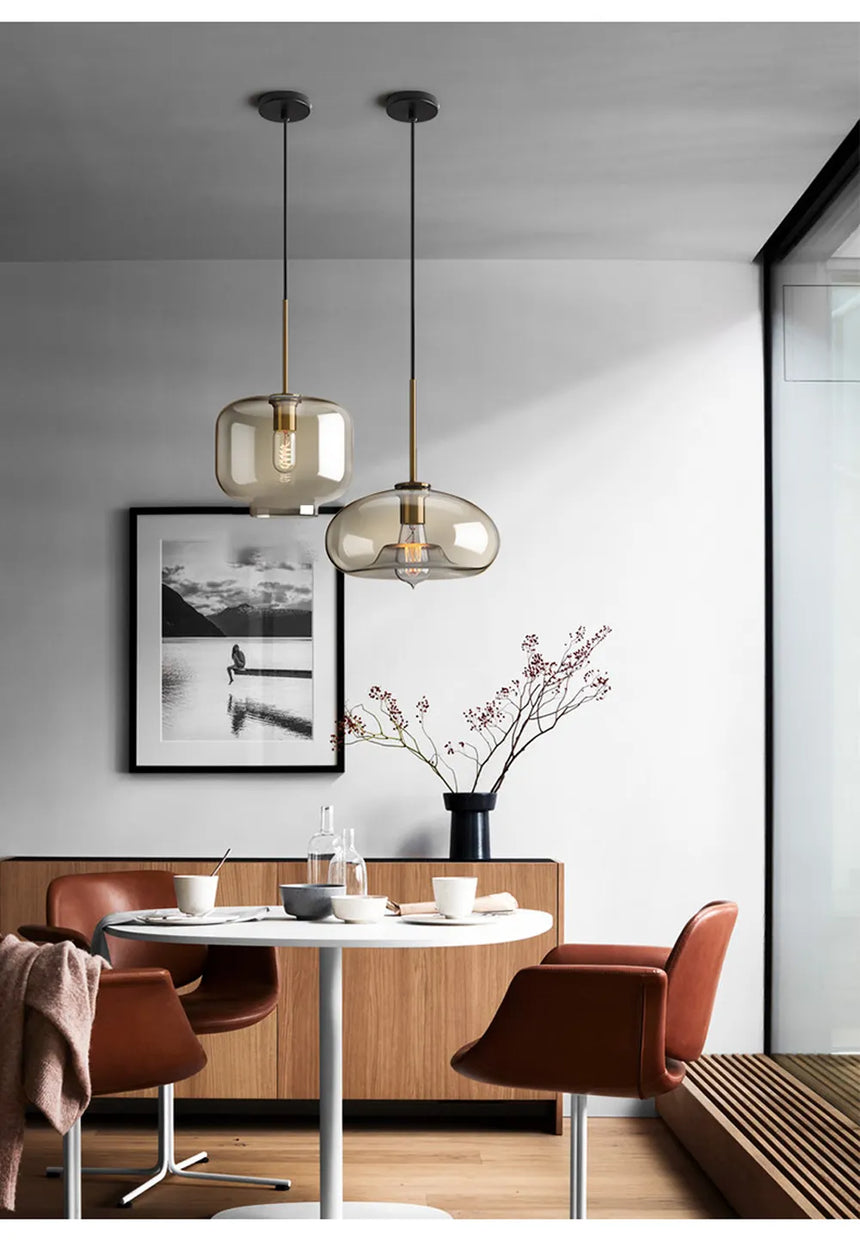Glass pendant light installed above kitchen island