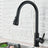 Black kitchen faucet installed on countertop