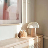 Table lamp combining wood and metal finishes