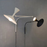 industrial-style swing arm wall lamp - styled bedroom setting