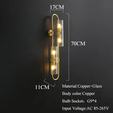 Bent brass tube detail on wall lamp