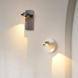 Wall lamp mounted beside a crib