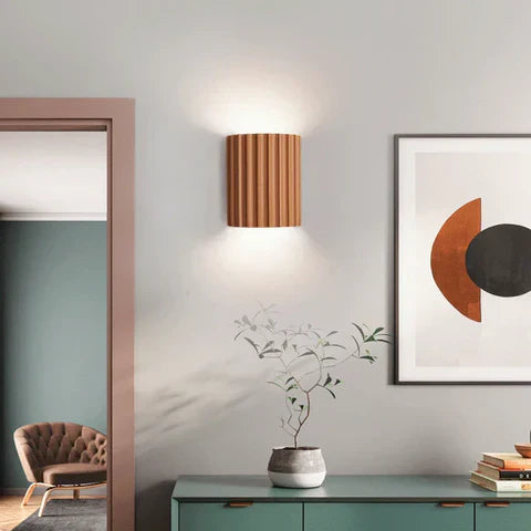 Wall mounted lamp for space saving placement