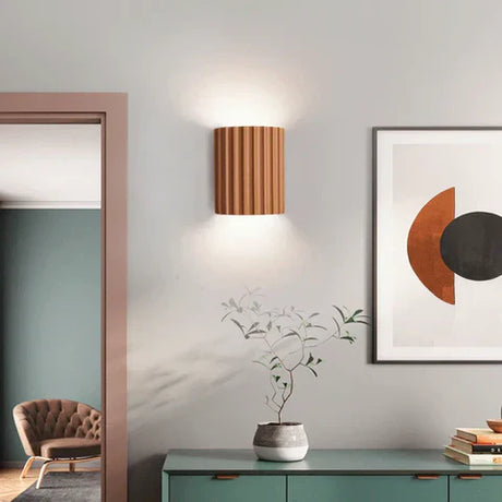 Wall mounted lamp for space saving placement