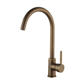 Antique bronze kitchen faucet installed in a kitchen setting