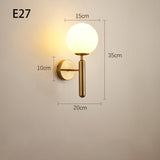 Metal and glass wall sconce for living room