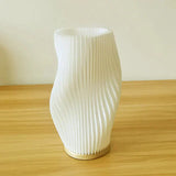 Rechargeable battery powered table lamp for flexible placement