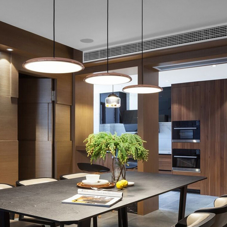 Minimalist disc-shaped pendant light for homes