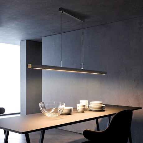 Pendant light illuminated above dining table