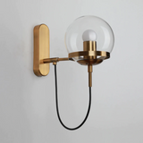 Gold finish wall sconce in a living room