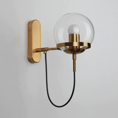 Gold finish wall sconce in a living room
