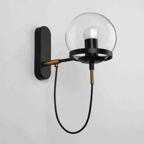 Metal ring detail on glass wall sconce