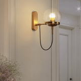 Black and gold wall sconce for entryway