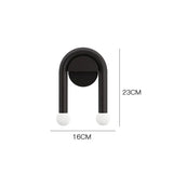 Entryway wall light with downward beam