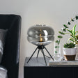 Smoked glass table lamp with modern tripod design