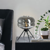 Smoked glass table lamp with modern tripod design
