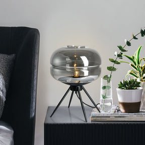 Smoked glass table lamp with modern tripod design
