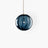 Amber glass pendant light installed above dining table - OpalDwell