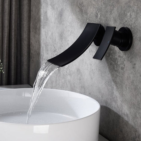Wall mounted waterfall faucet installed in a bathroom setting