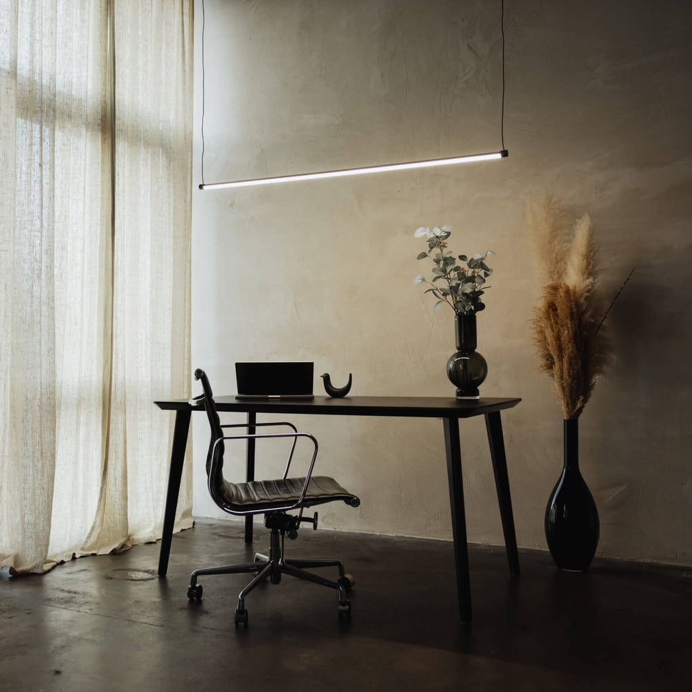 Glass pendant light with sleek modern silhouette design