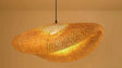 woven rattan pendant light for boho interiors
