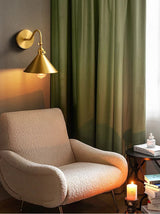Wall sconce mounted above a reading chair