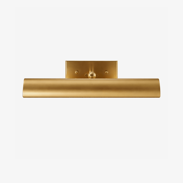 Rolled brass shade under a flat plate, the front edge curving downward