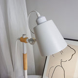 Close view of the white metal head and the wire bail over its top