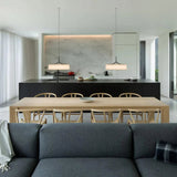 Two flat drum shades above a kitchen island