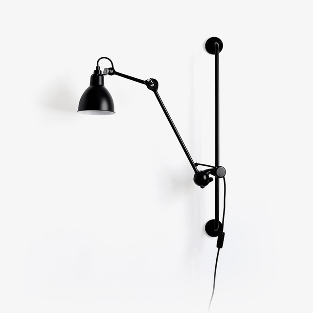 Swing arm wall lamp with a black cone shade, a jointed arm and a hanging cord