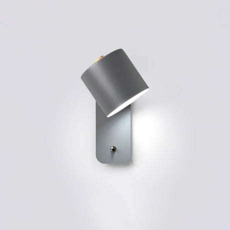 The gray version tilted down, the round plate and push button clearly visible