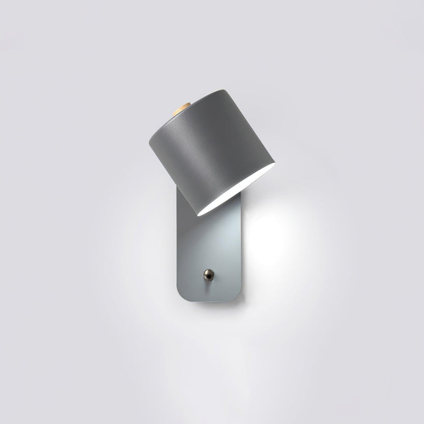 The gray version tilted down, the round plate and push button clearly visible