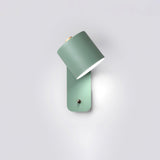 The green version seen at an angle, the cylinder tilted out from its plate