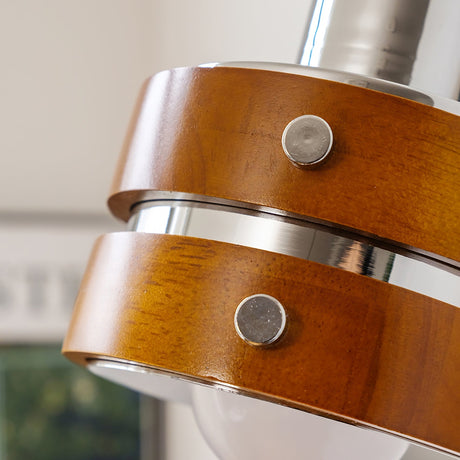 Detail of the walnut drum with its chrome banding and fixing studs