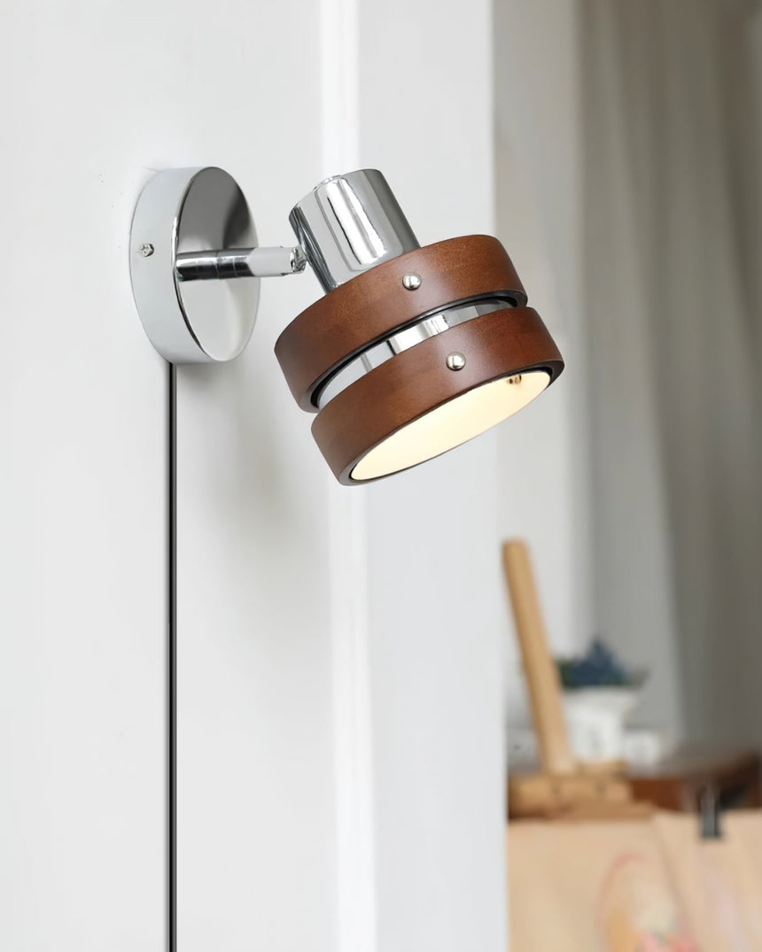 Side view of the fitting on a white wall with the cord hanging