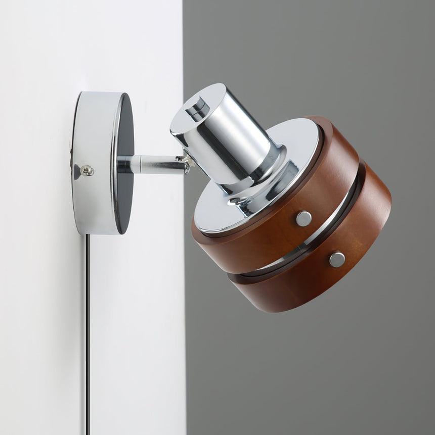 Close view of the chrome swivel joint and the round wall plate