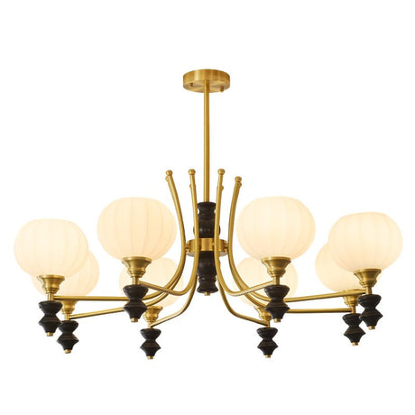 The fitting seen angled, brass arms and black drops in clear view