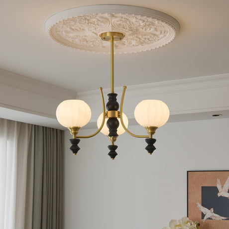 Rounded opal glass shades and the black drops hanging under the arms
