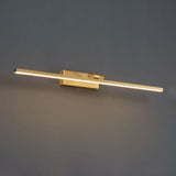 Close view of the offset bracket lifting the brass bar clear of a dark wall