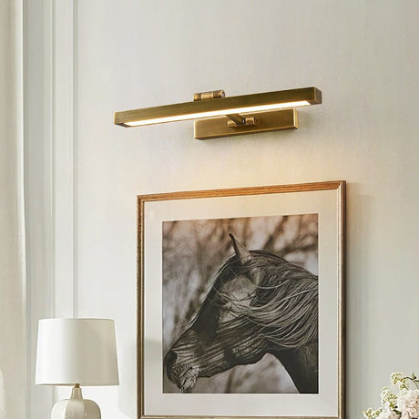 Vanity light with a brass shade