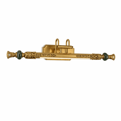 The ornate bar seen at an angle, the green stone finials catching the light