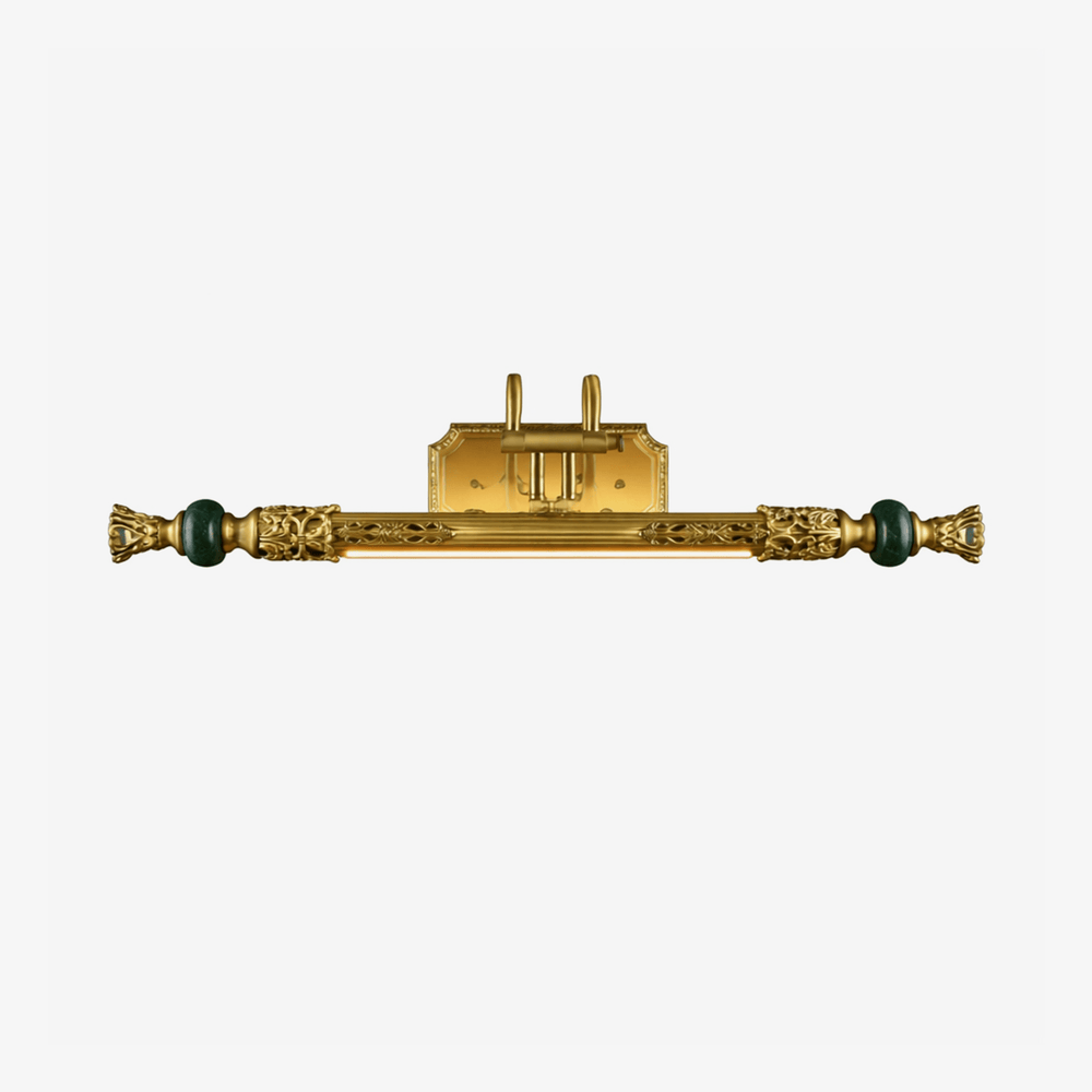 Long ornate brass bar with cast detail and a green stone bead at each end