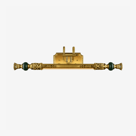 Long ornate brass bar with cast detail and a green stone bead at each end