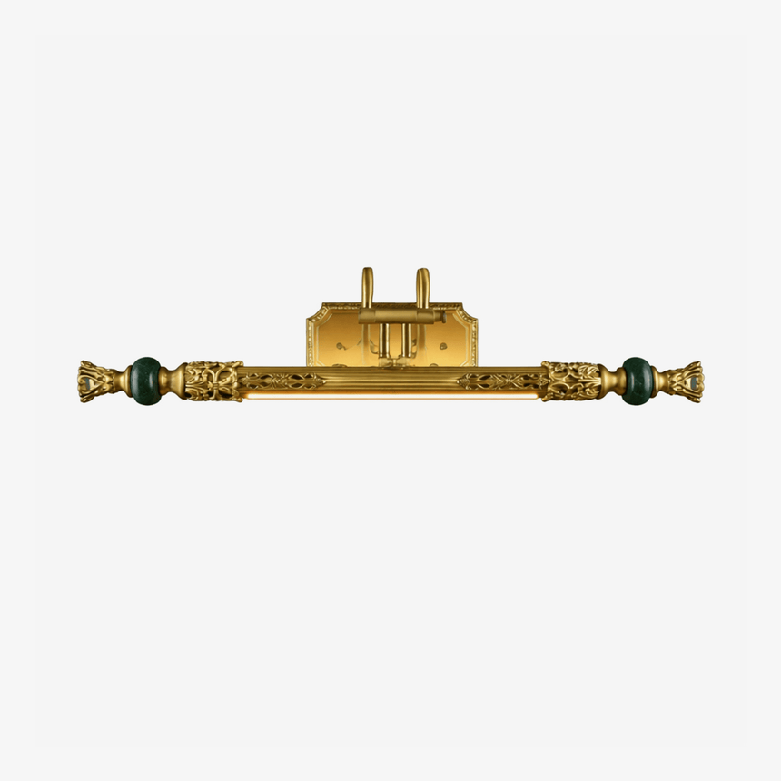 Long ornate brass bar with cast detail and a green stone bead at each end